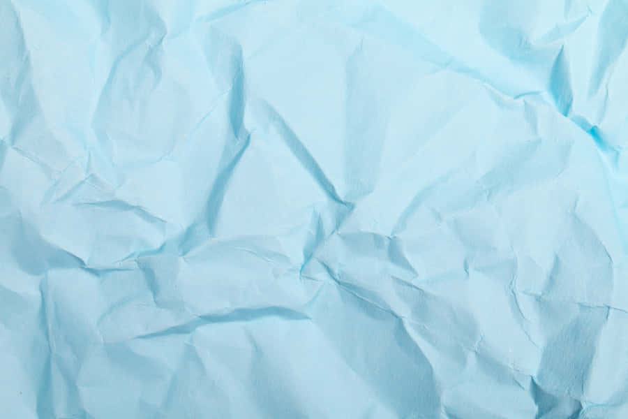 a blue paper with crumpled edges Background