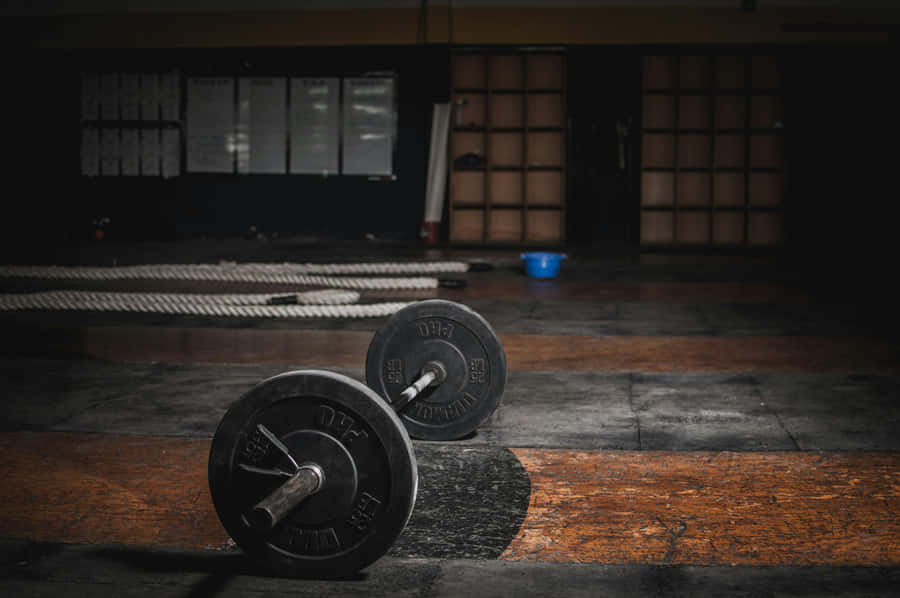 Dark Gymwith Barbellon Floor