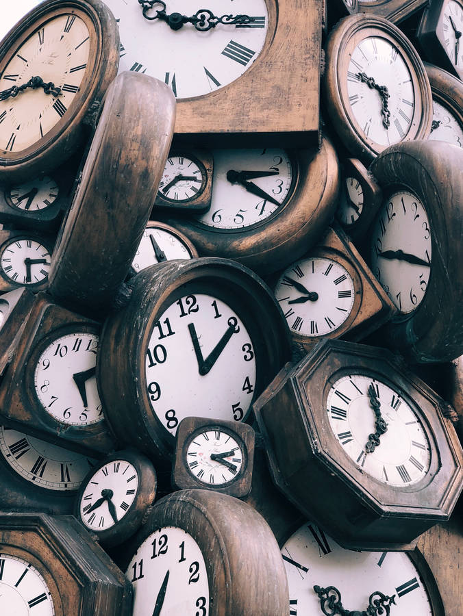 Pile of wooden clocks wallpaper