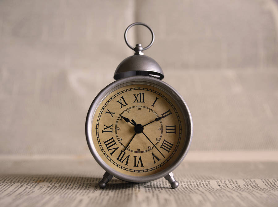 Silver clock with Roman numbers wallpaper